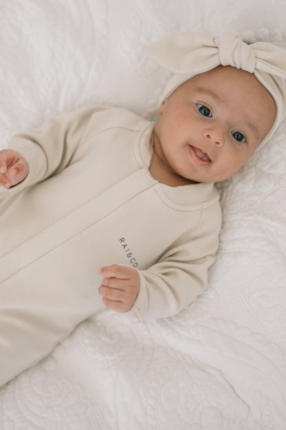 Baby wearing a Apple Headbands in Beige on a white background