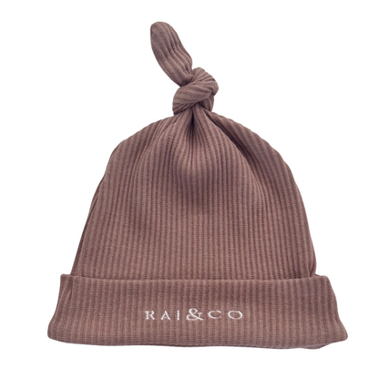 Baby Beanie Ribbed Knotted in Caramel and 'RAI&CO' branding on a white background
