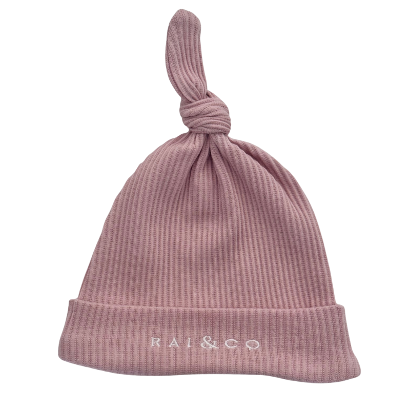 Baby Beanie Ribbed Knotted in Powder Pink with 'RAI & CO' branding on a white background