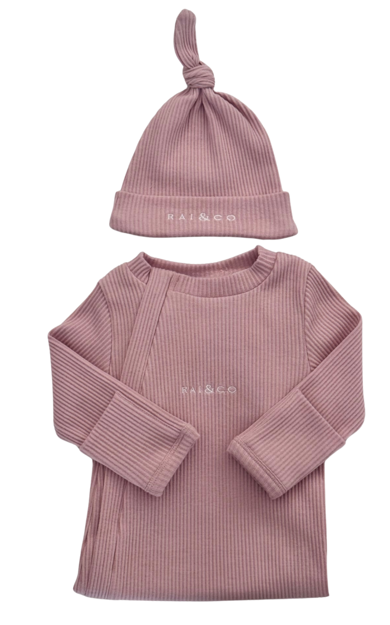 Pink ribbed baby outfit with long-sleeve top and Baby Beanie Ribbed Knotted Powder in Pink on a white background