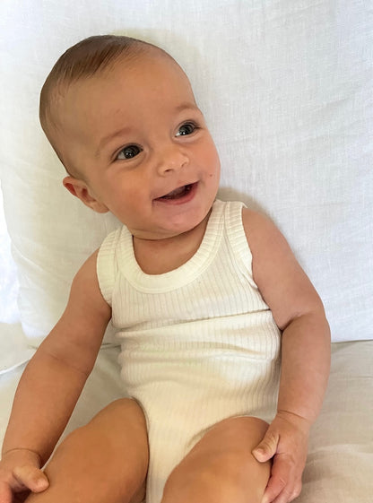 a baby wearing a Basic Singlet Bodysuit in White on a white background