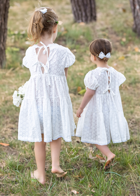 two young child wearing a Eliza Embroidered Lace Dress in White 