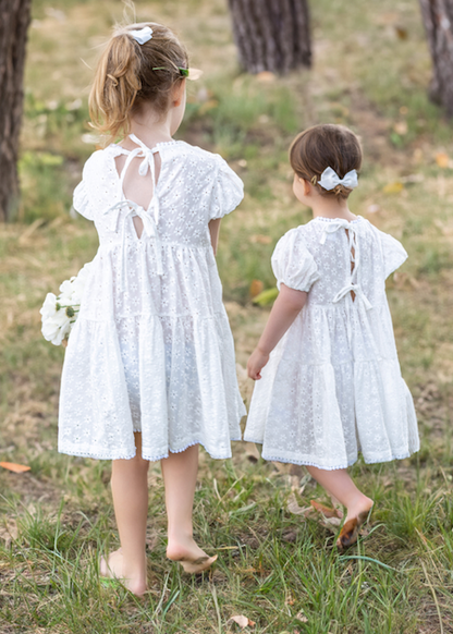 two young child wearing a Eliza Embroidered Lace Dress in White 