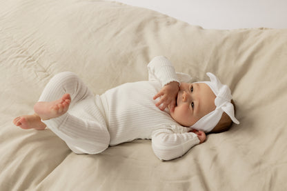 Baby wearing a Frill Basic Long Sleeve Bodysuit in White 