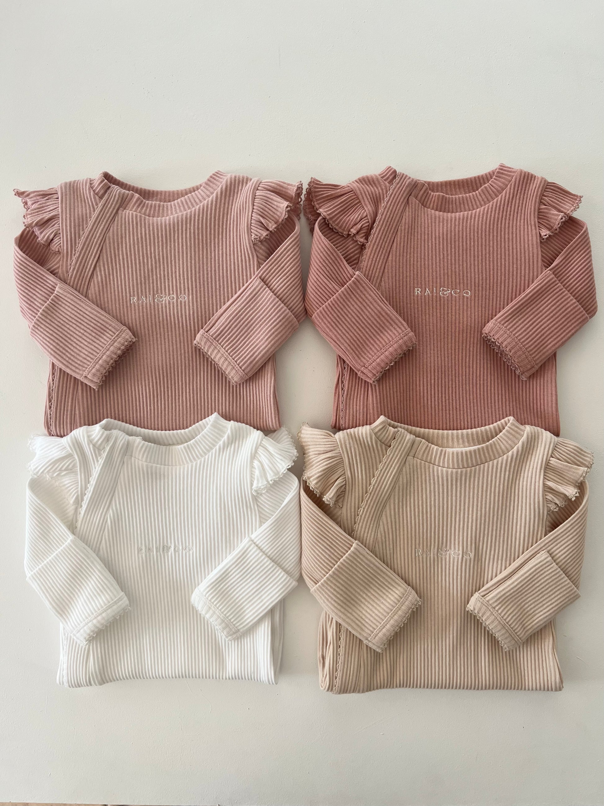 Frill Ribbed Onesie in Available Colours on a white background 