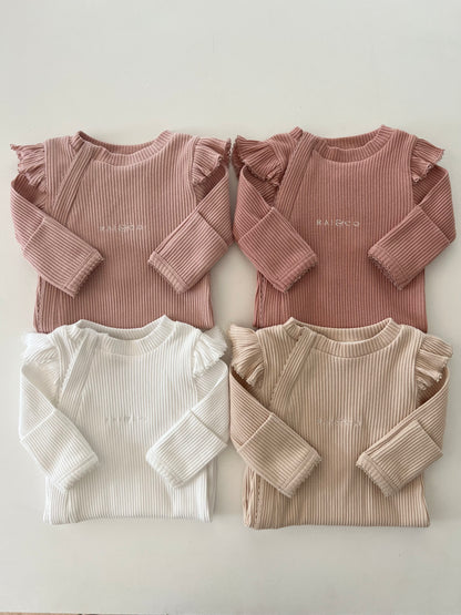 Frill Ribbed Onesie in Available Colours on a white background 