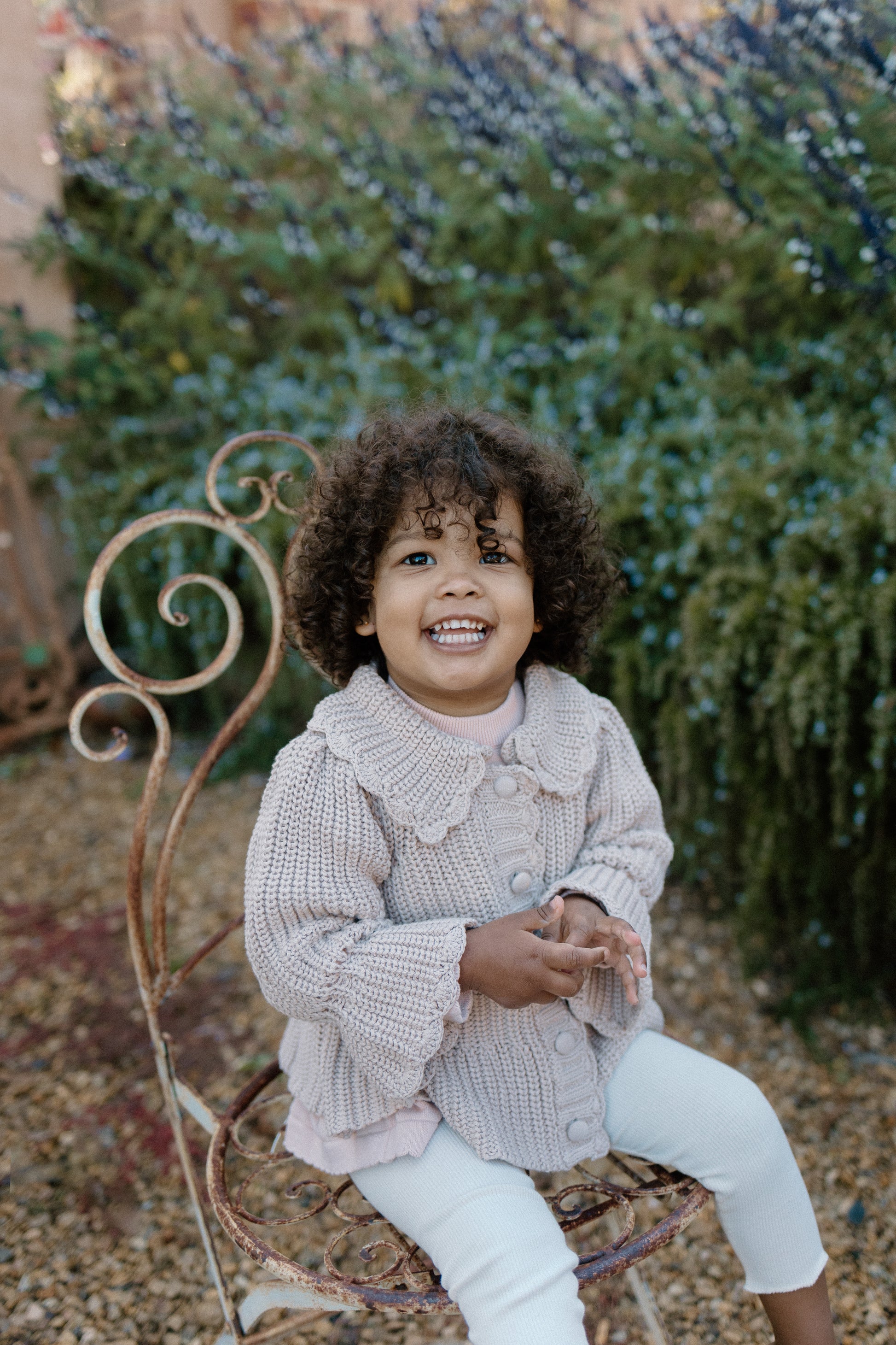 a young child wearing a Kenya Cardigan 