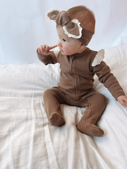 A baby wearing a Lace Headband in Chocolate