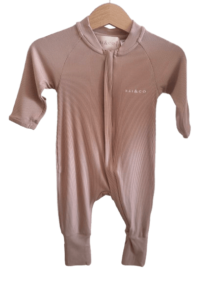 Lightweight Eco Onesie in Beige  with a hood on a hanger against a checkerboard transparency pattern