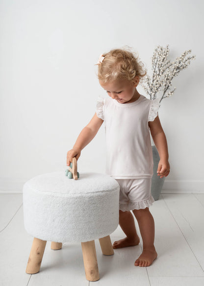 Baby wearing a Mini Ribbed Lace Frill in White 