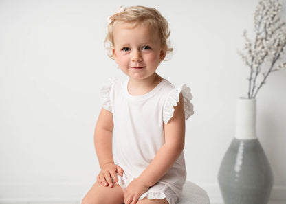 Baby wearing Mini Ribbed Lace Frill in White