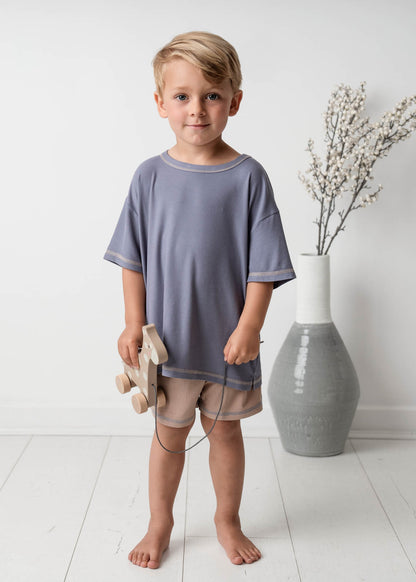 A boy standing wearing a Mini Ribbed Oversized T-shirt in Royal Blue 