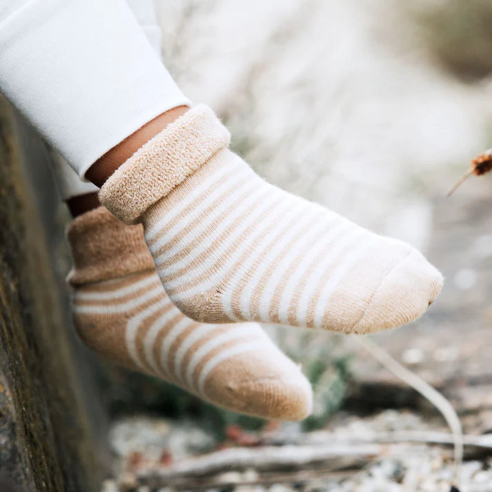 Organic undyed cotton striped socks in blurred background