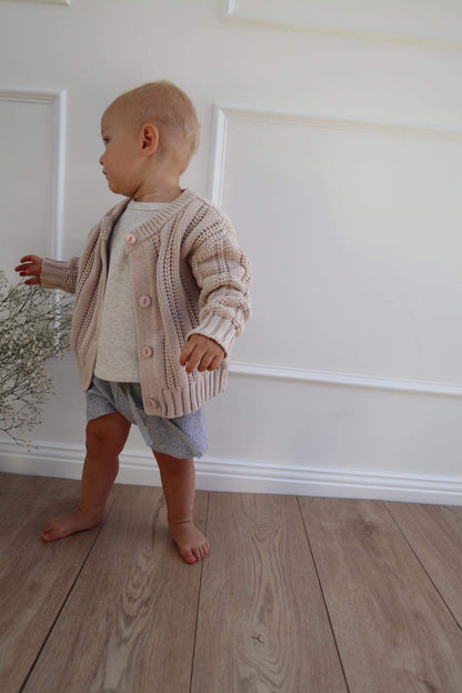 Baby wearing a Chunky Knitted Cardigan in Beige 