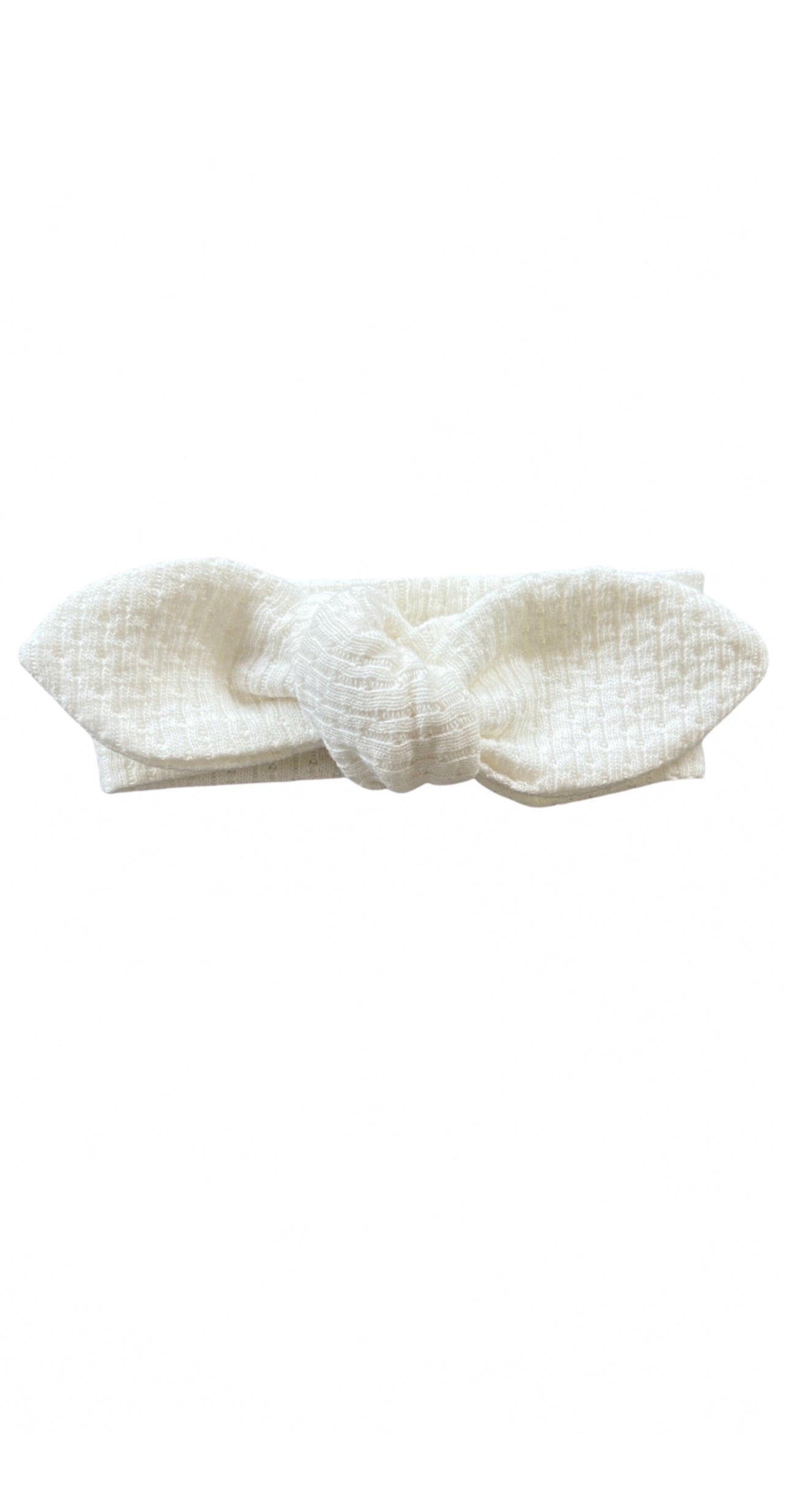 Knitted Knot Headband in White on a white background