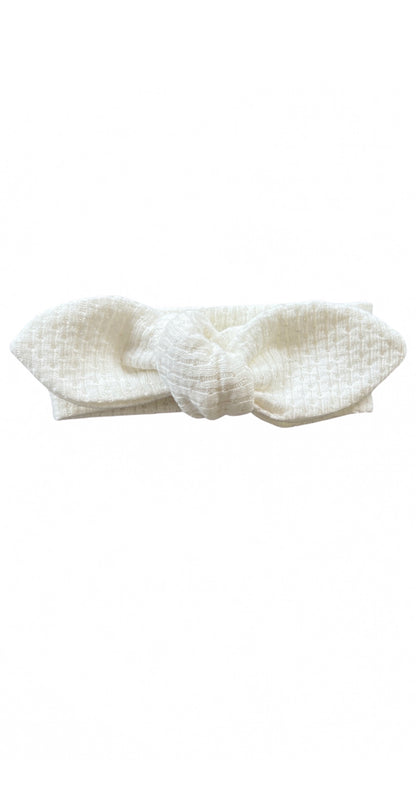 Knitted Knot Headband in White on a white background
