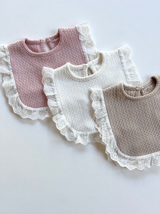Knitted Lace Frill Bib on Available Colours on a white background
