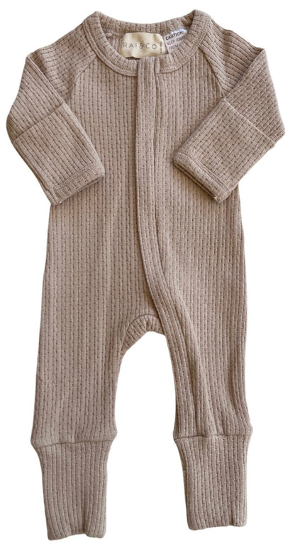 Knitted Onesie in Beige on a white background