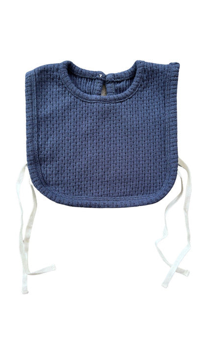 Knitted Plain Bib in Navy on a white background